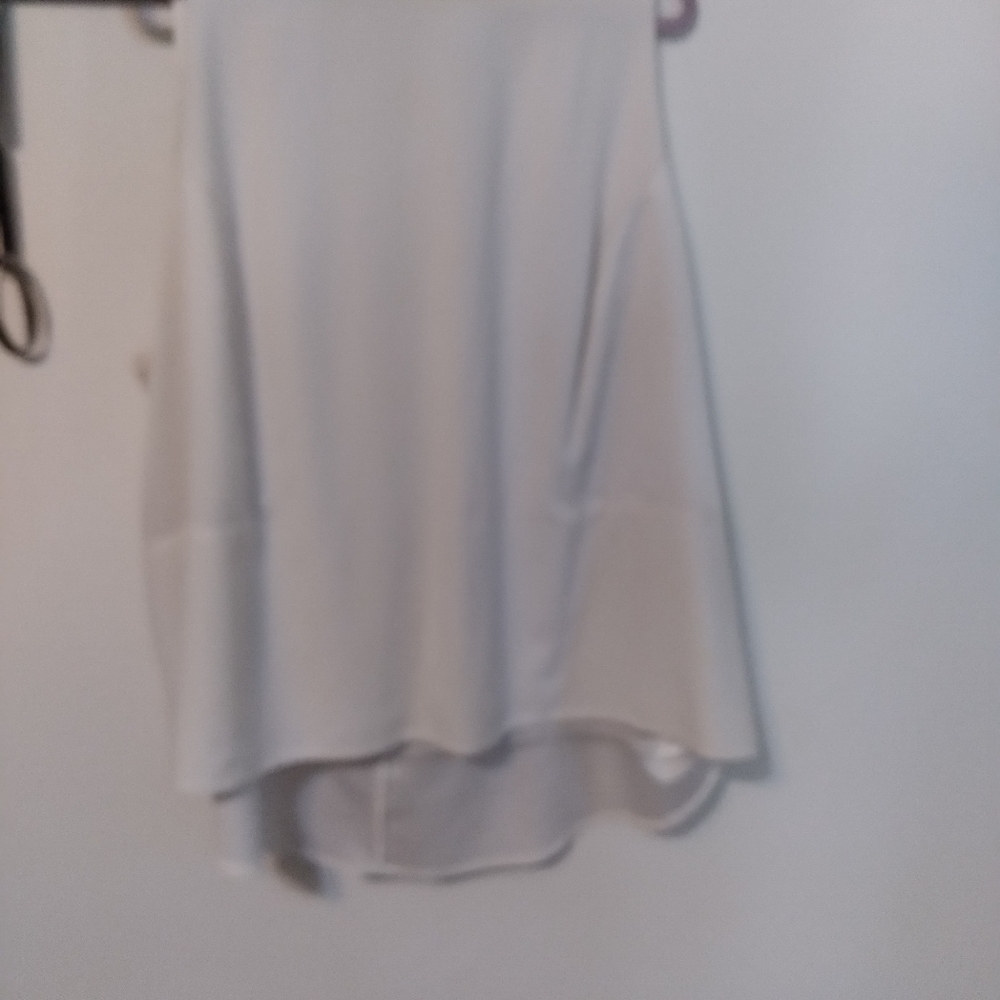 White top with silver zipper and peplum